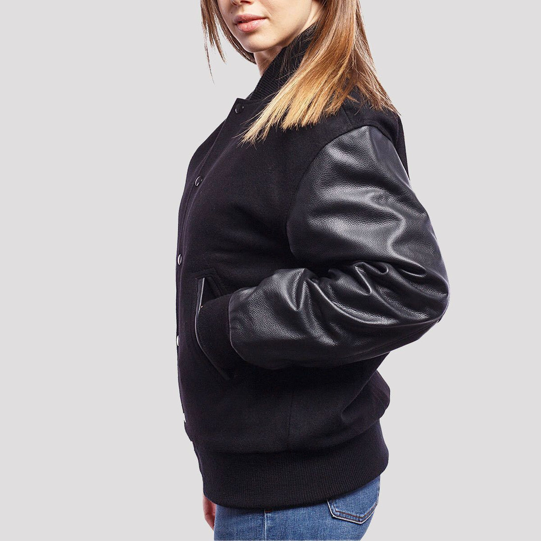 Classic black wool letterman jacket with sleek leather sleeves, offering a timeless varsity style