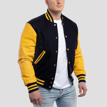 Navy blue wool letterman jacket with striking lemon leather sleeves, combining classic style with a modern twist.