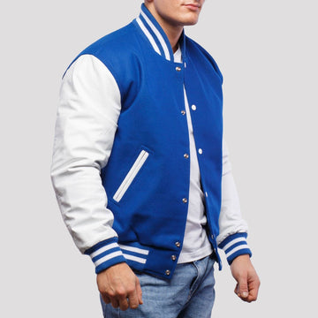 Classic fit royal blue wool letterman jacket with white leather sleeves, offering a timeless varsity look