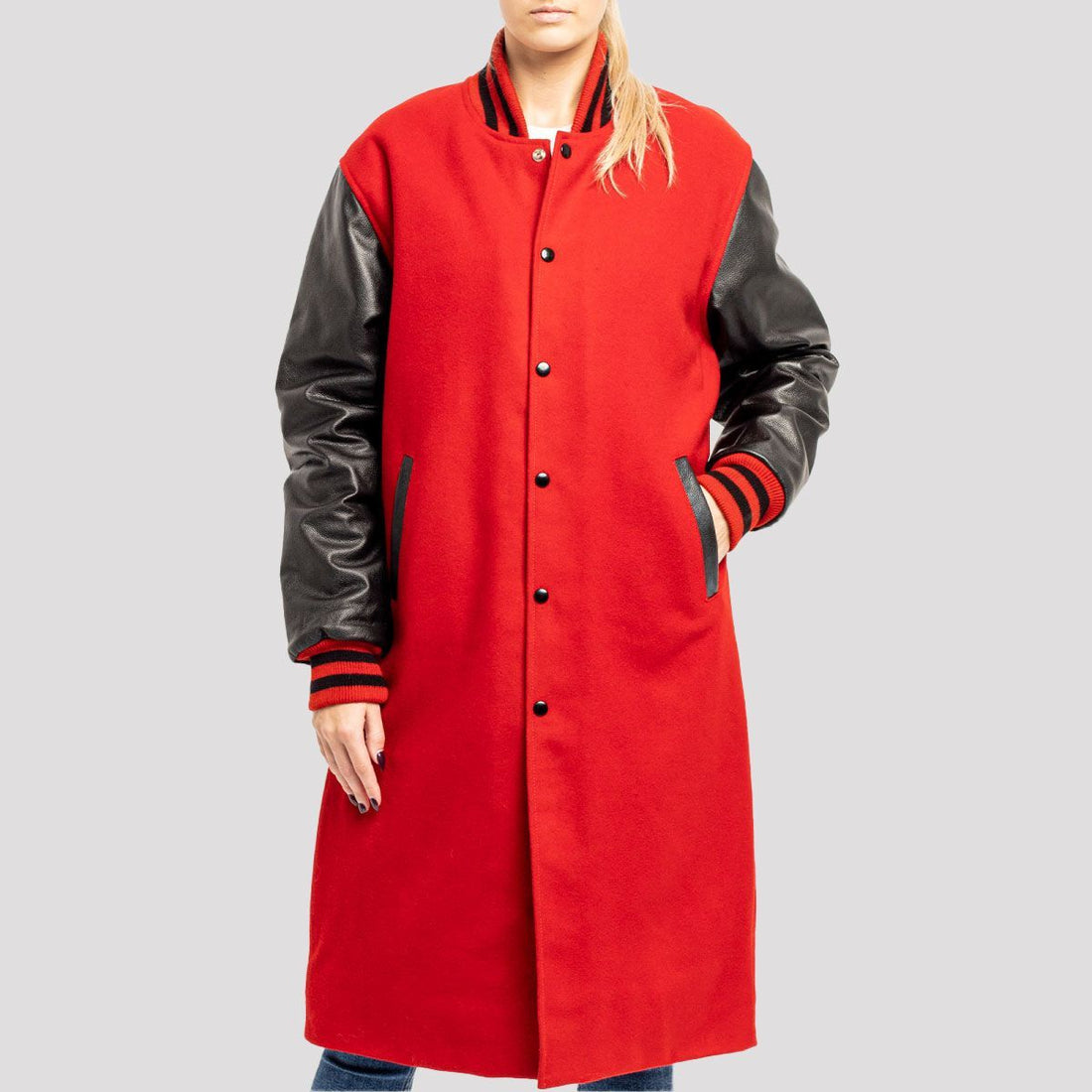 Scarlet red wool varsity letterman coat with black leather sleeves, combining classic style and modern sophistication