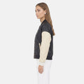 Two-tone varsity jacket for women with black body and beige sleeves