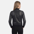 Classic black leather jacket outfit for women with modern minimalist look