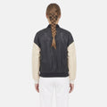 Stylish leather varsity jacket for women with contrast sleeves and modern fit