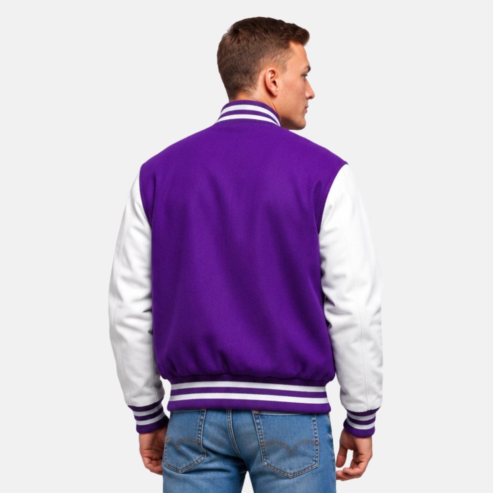 Back view of purple wool varsity jacket with white leather sleeves and striped ribbed waistband and cuffs.