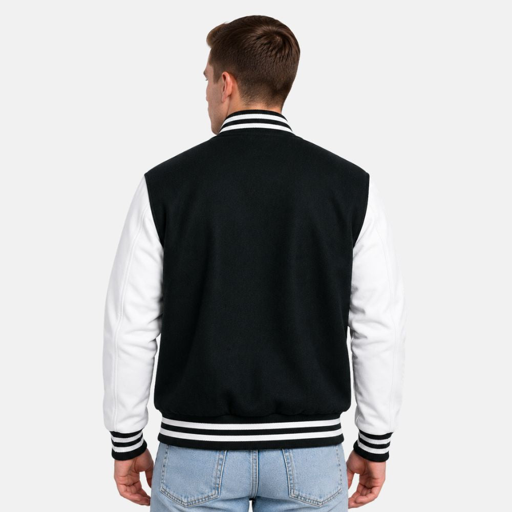 Back view of Dartmouth green wool varsity jacket featuring white leather sleeves and ribbed striped waistband.