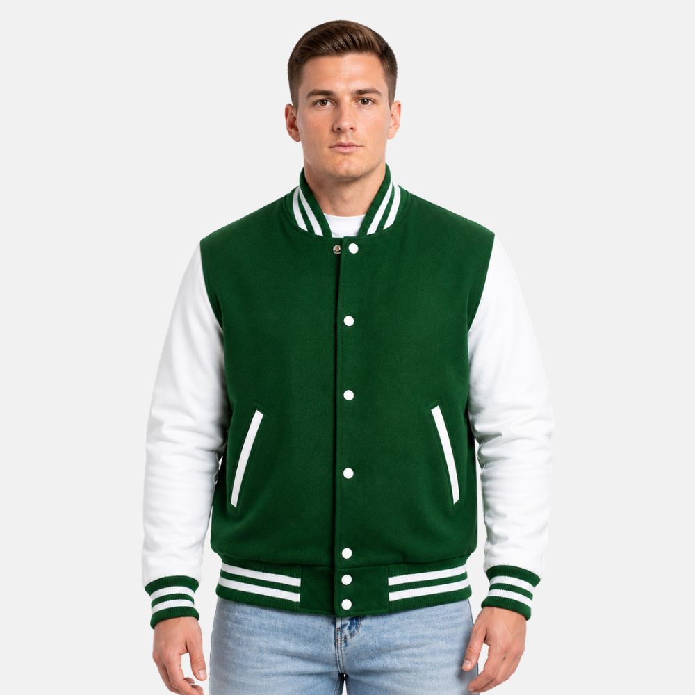 Men wearing a Kelly green wool varsity jacket with white leather sleeves and striped ribbed trims on a light gray background.