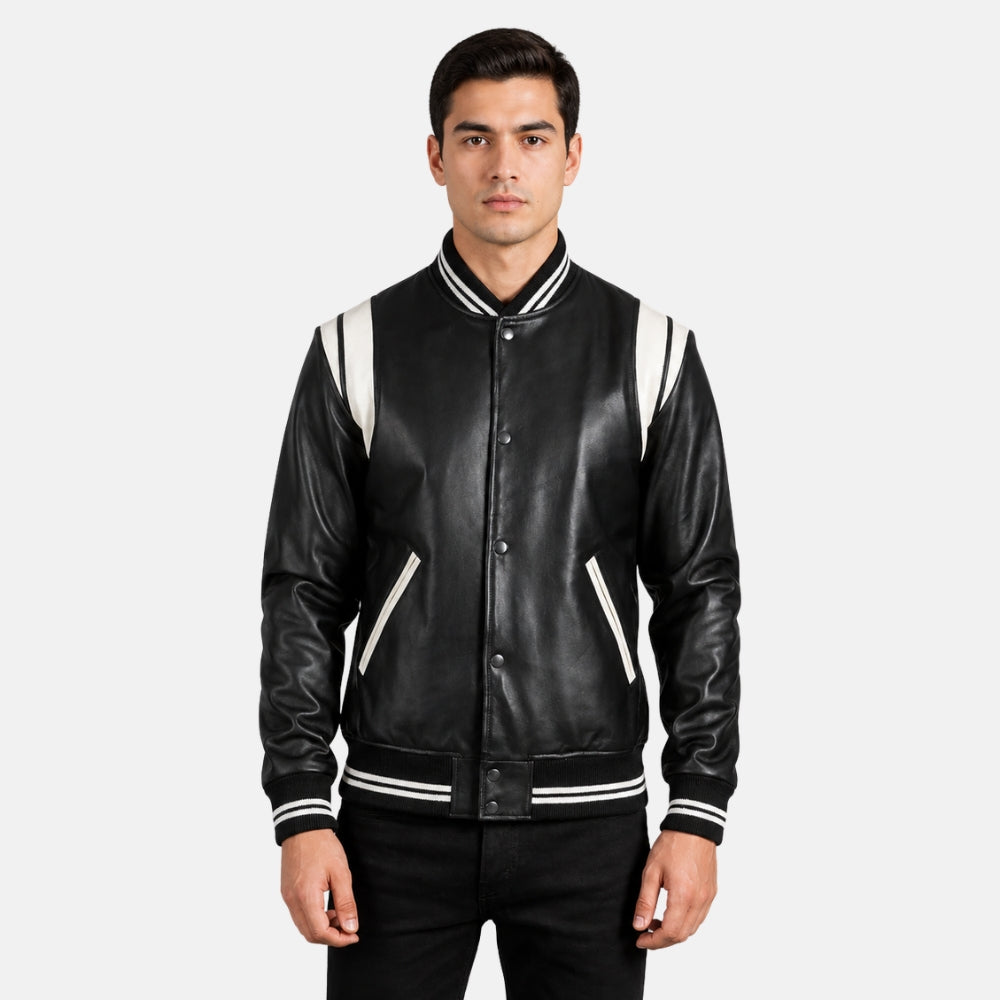 Man wearing a black leather jacket with white accents on a light gray background