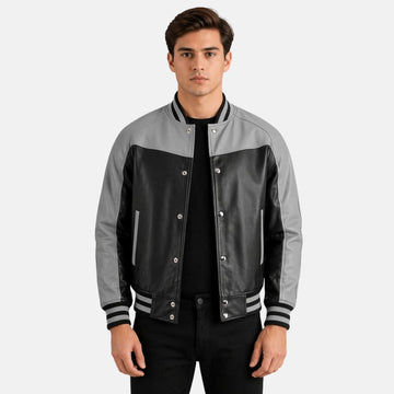 Man wearing a gray and black varsity jacket on a white background