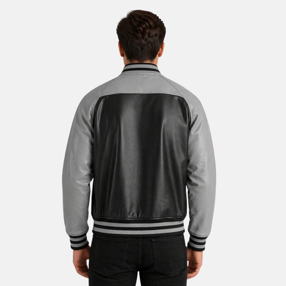 Person wearing a gray and black jacket on a white background