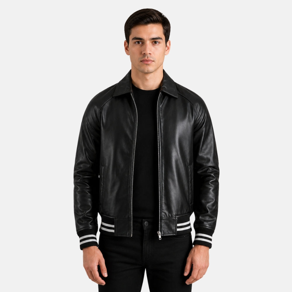 Man wearing a black leather jacket with white stripes on a light gray background