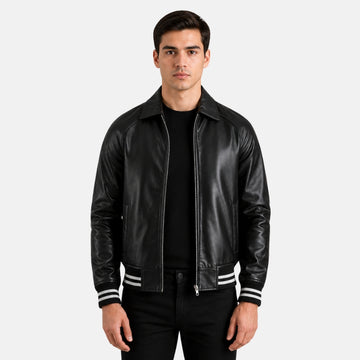 Man wearing a black leather jacket with white stripes on a light gray background