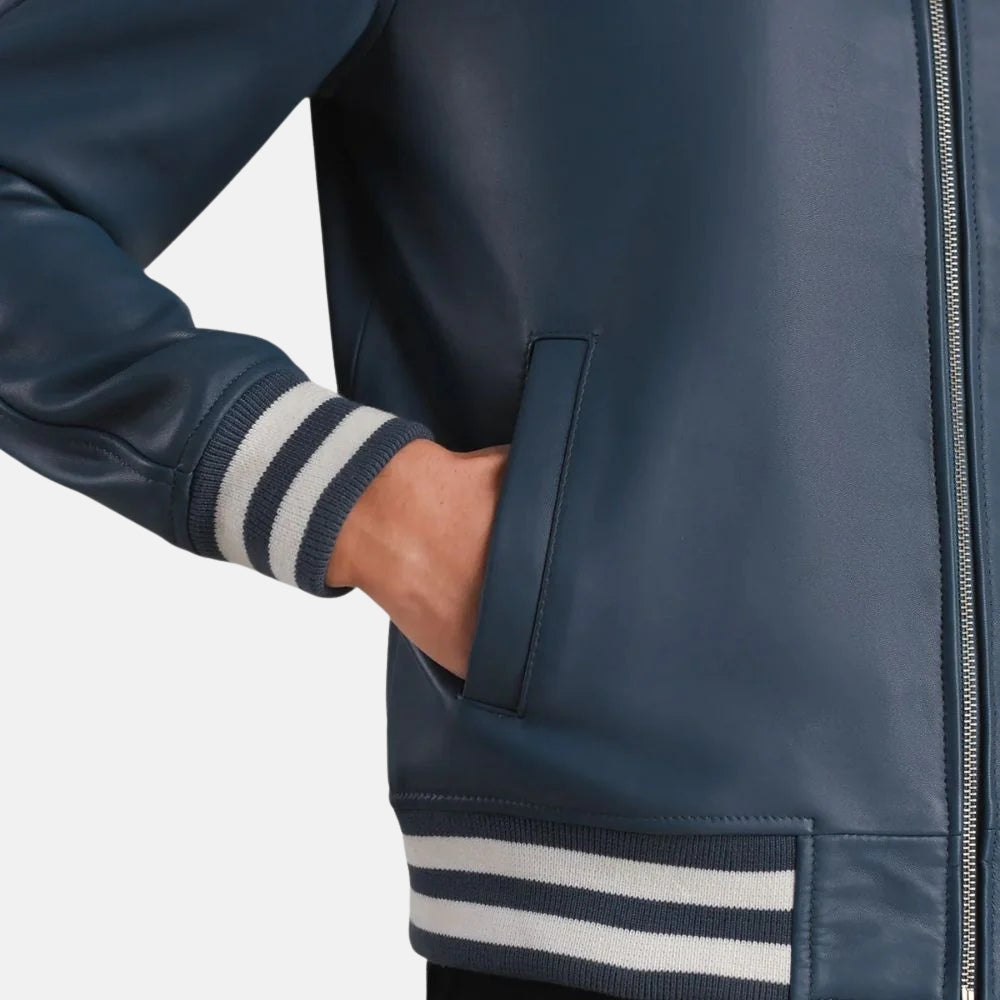 Navy blue jacket with striped cuffs on a light gray background