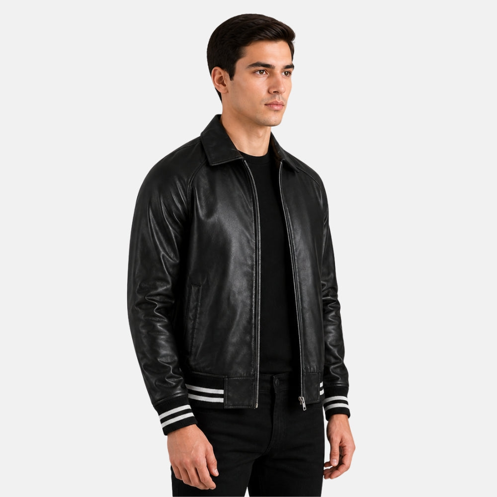 Man wearing a black leather jacket with white stripes on a gray background