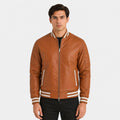 Man wearing a brown leather jacket with white accents on a white background