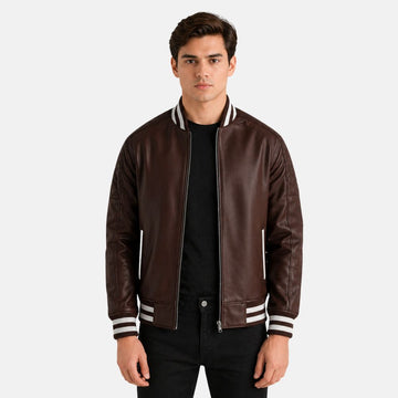 Man wearing a brown leather jacket with white trim on a light gray background