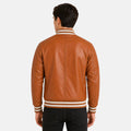 Man wearing a brown leather jacket with white stripes on a white background