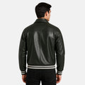 Man wearing a black leather jacket with white stripes on a white background