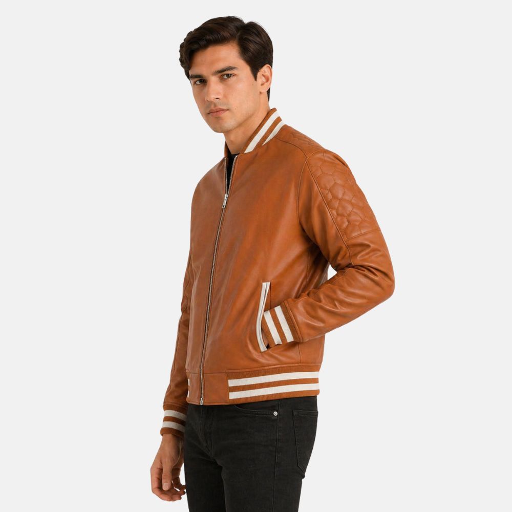 Men’s brown leather bomber jacket with striped ribbed cuffs and hem, front zip closure, worn over a black shirt.
