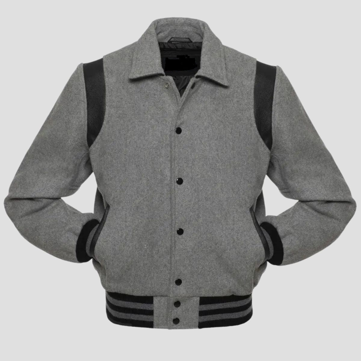 A grey wool letterman-style jacket with black leather sleeves and rib-knit trim on the collar, cuffs, and hem, featuring a snap button closure.