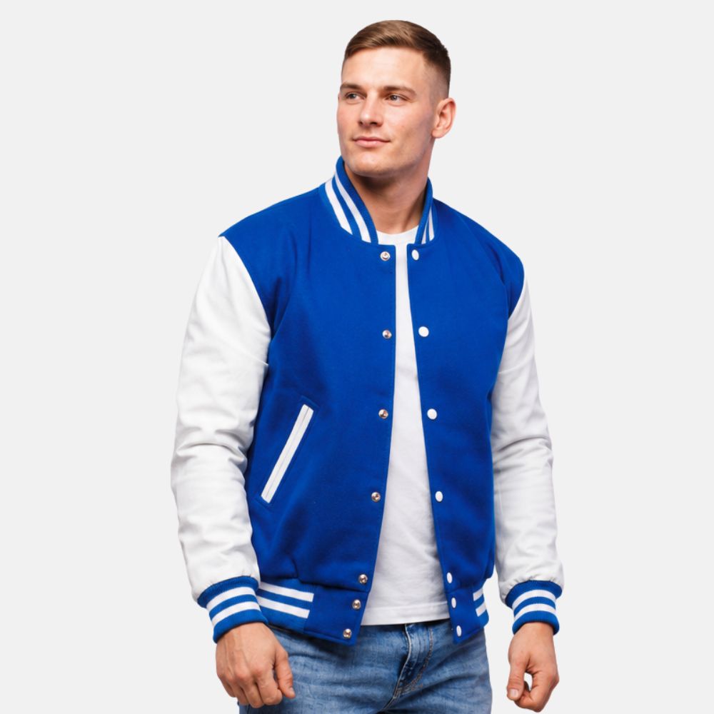 Men’s royal blue wool letterman jacket with white leather sleeves, ribbed striped collar, cuffs, and front snap closure.