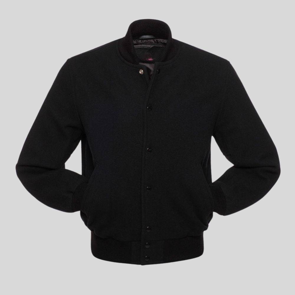 All black wool varsity letterman jacket for men with snap button front, ribbed cuffs, soft lining, and classic streetwear style.