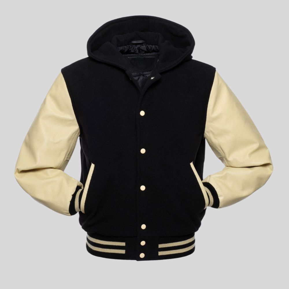 Black and cream varsity jacket with a hood on a gray background