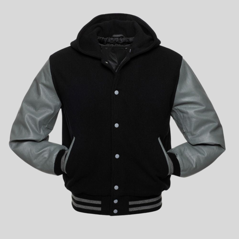Black and gray varsity jacket with a hood on a light gray background