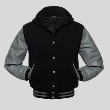 Black and gray varsity jacket with a hood on a light gray background