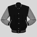 Black and gray varsity jacket on a light gray background
