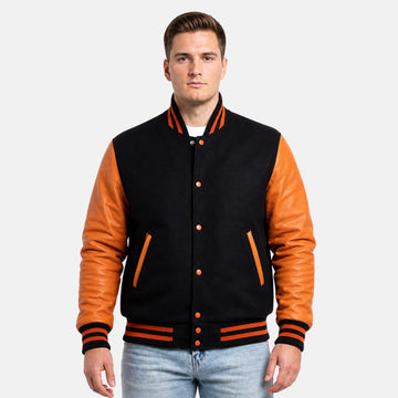 Man wearing a black and orange varsity jacket on a white background
