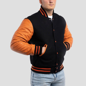 Classic fit black wool varsity jacket with bold orange leather sleeves, perfect for a sporty and timeless look