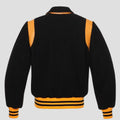 Black yellow wool letterman jacket for men with snap buttons, striped rib waistband, leather trim details, and vintage streetwear look.