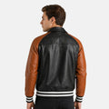 Man wearing a black and brown leather jacket on a white background