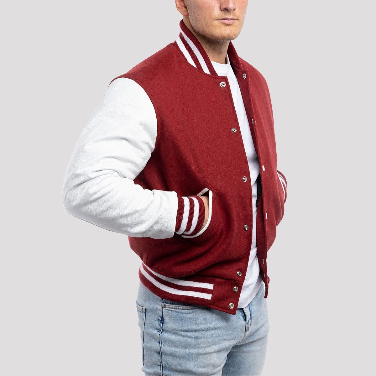 Classic fit varsity jacket with cardinal red wool body and white leather sleeves, offering a timeless and bold look