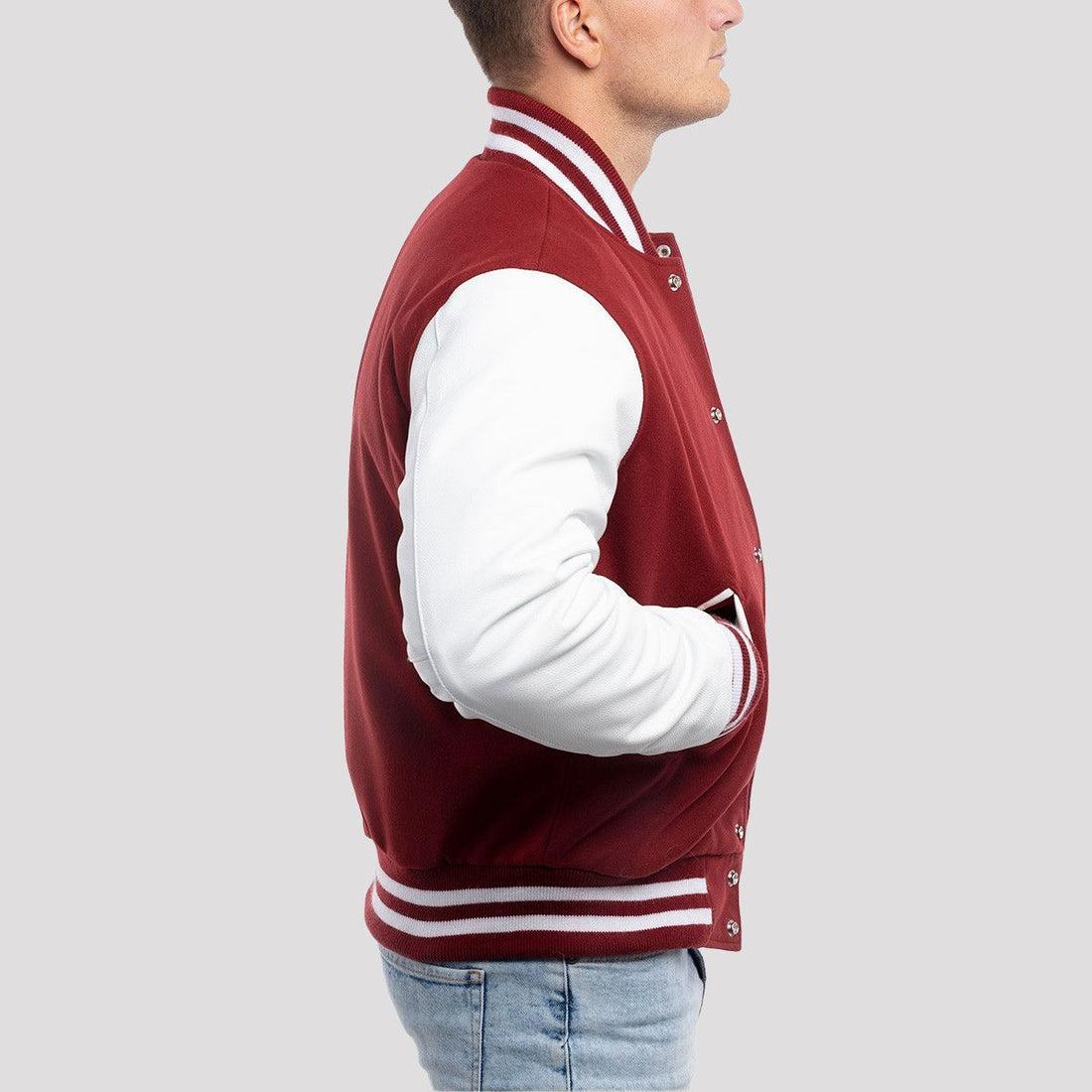 Classic fit varsity jacket with cardinal red wool body and white leather sleeves, offering a timeless and bold look