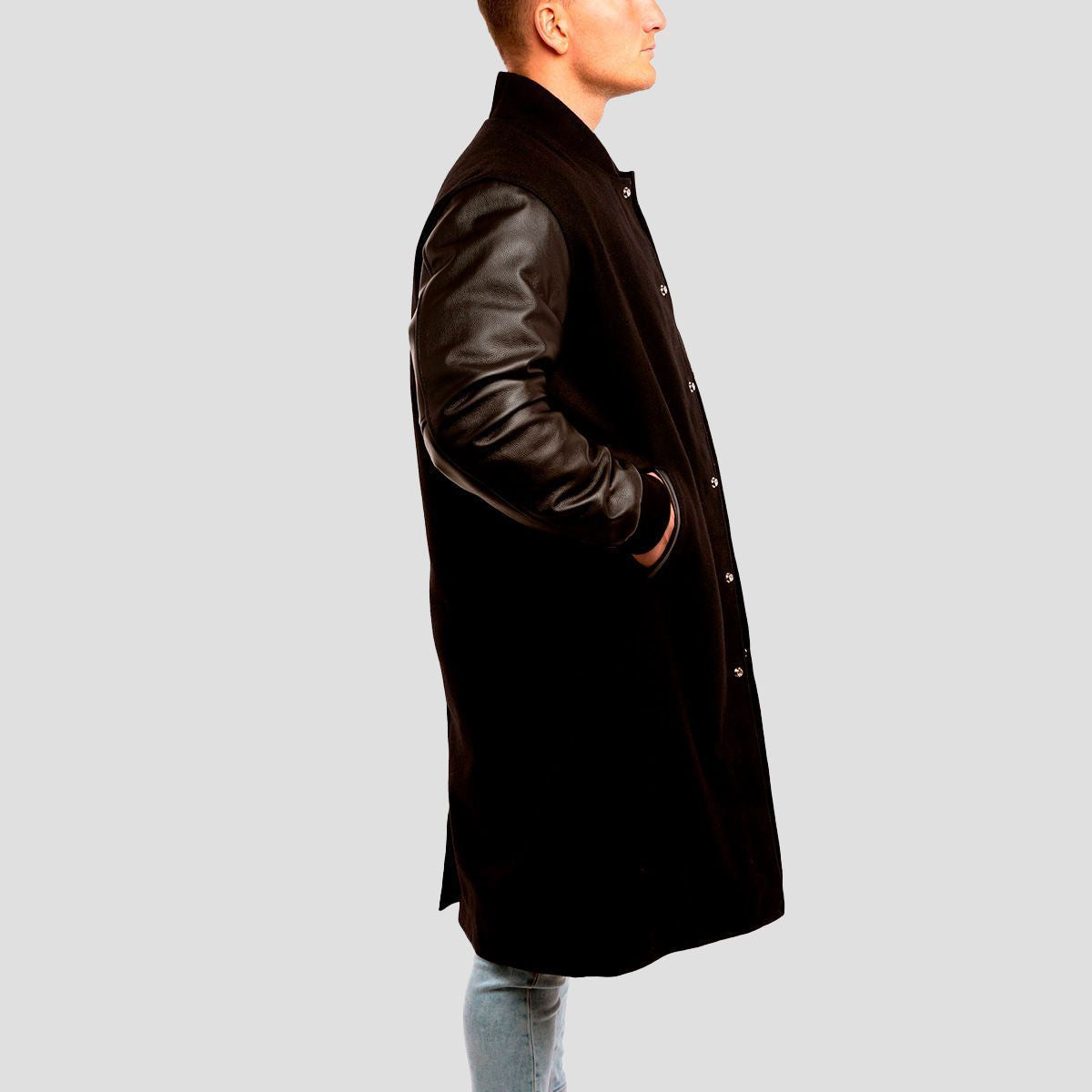 Classic black letterman coat featuring black leather sleeves and wool design