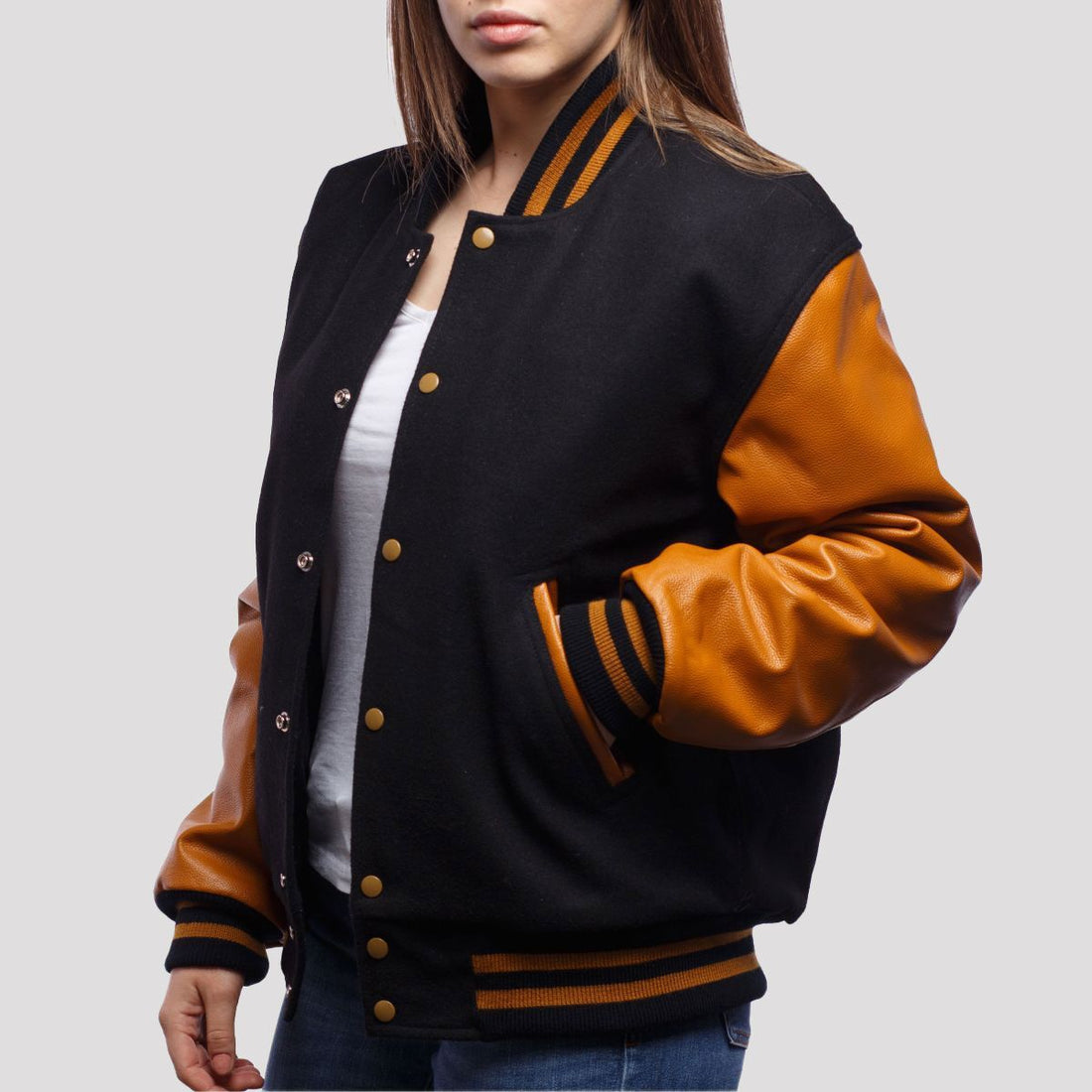 Classic black wool varsity jacket with old gold leather sleeves, offering a bold and sophisticated varsity style.