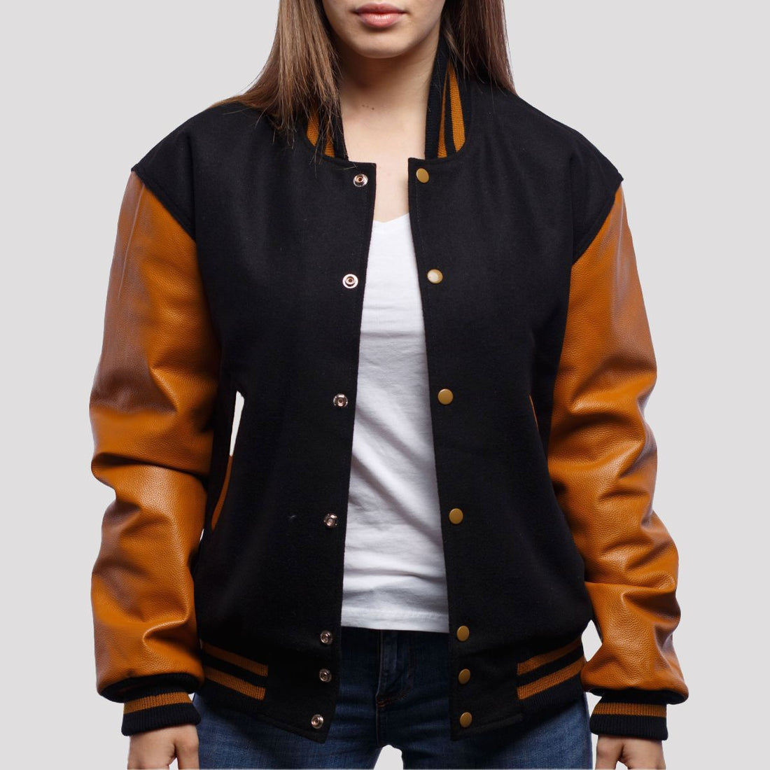 Classic black wool varsity jacket with old gold leather sleeves, offering a bold and sophisticated varsity style.