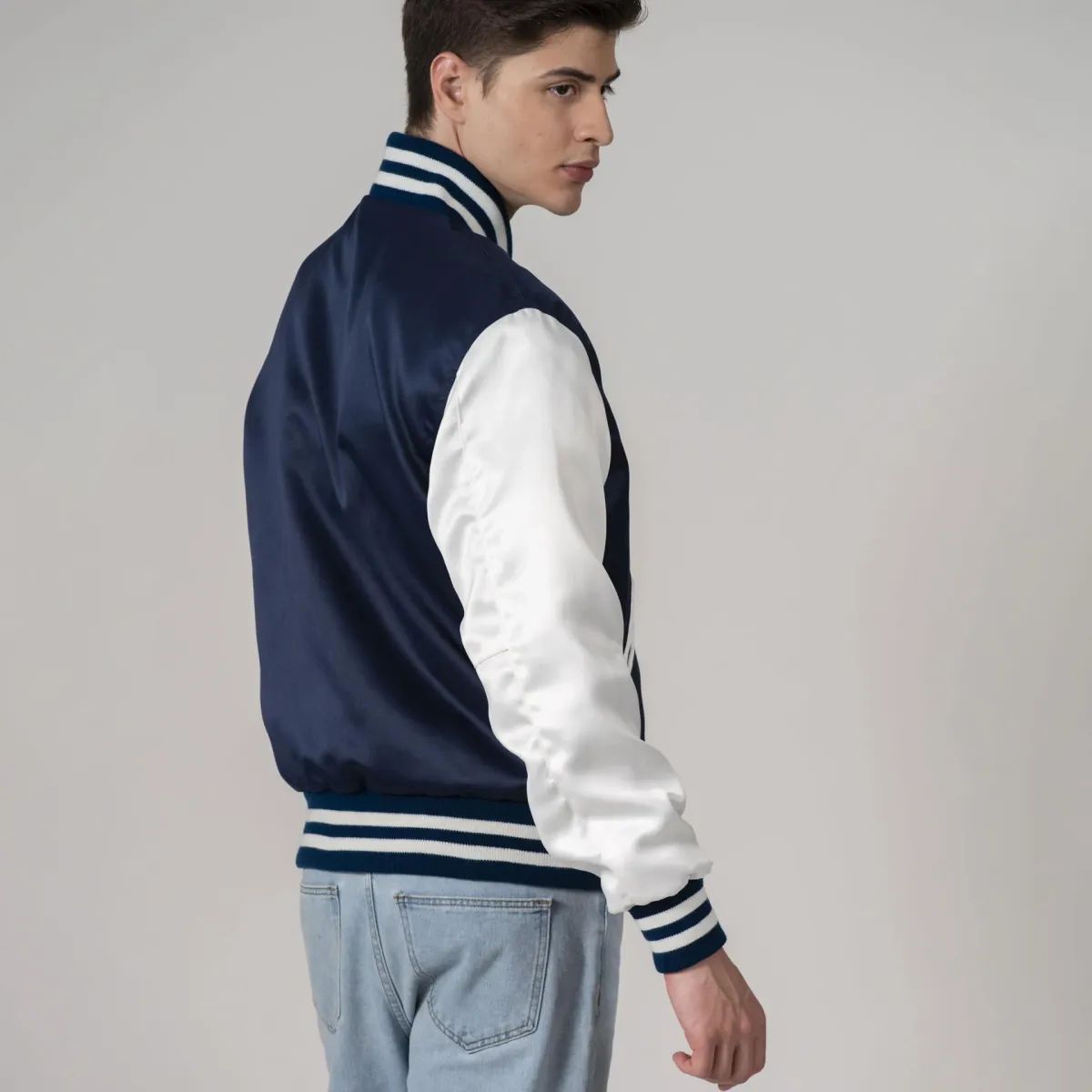 Men's varsity jacket in classic navy blue satin with white sleeves