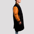 Men's elegant letterman coat in black wool with old gold leather sleeves, perfect for upscale casual wear