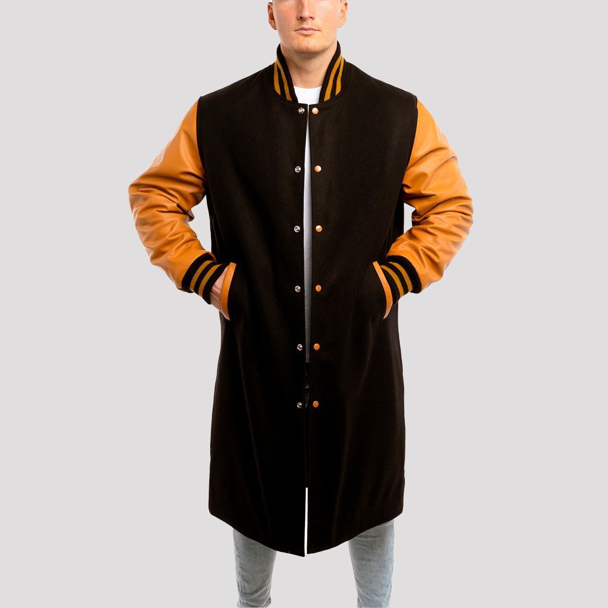 Elegant black wool letterman coat with luxurious old gold leather sleeves, blending classic and modern style