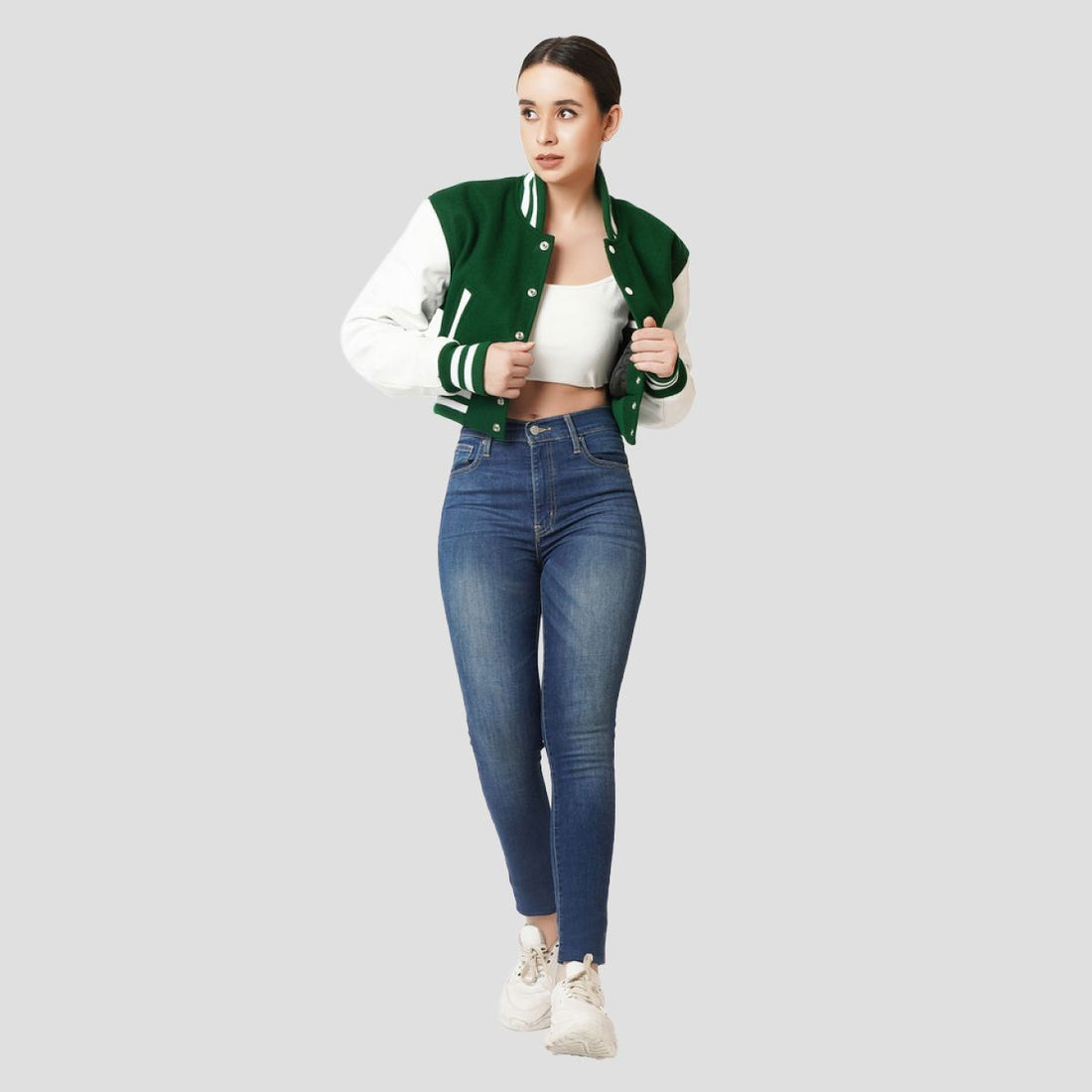 Kelly green crop top varsity jacket with bold white sleeves, offering a trendy and sporty look