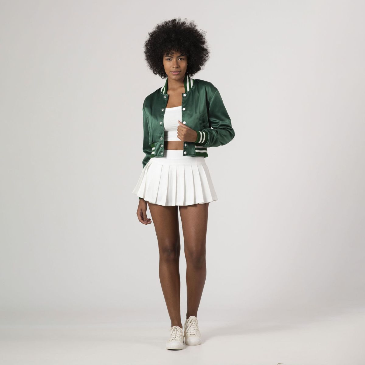 Trendy Kelly green crop top varsity jacket in satin, combining elegance with a casual vibe