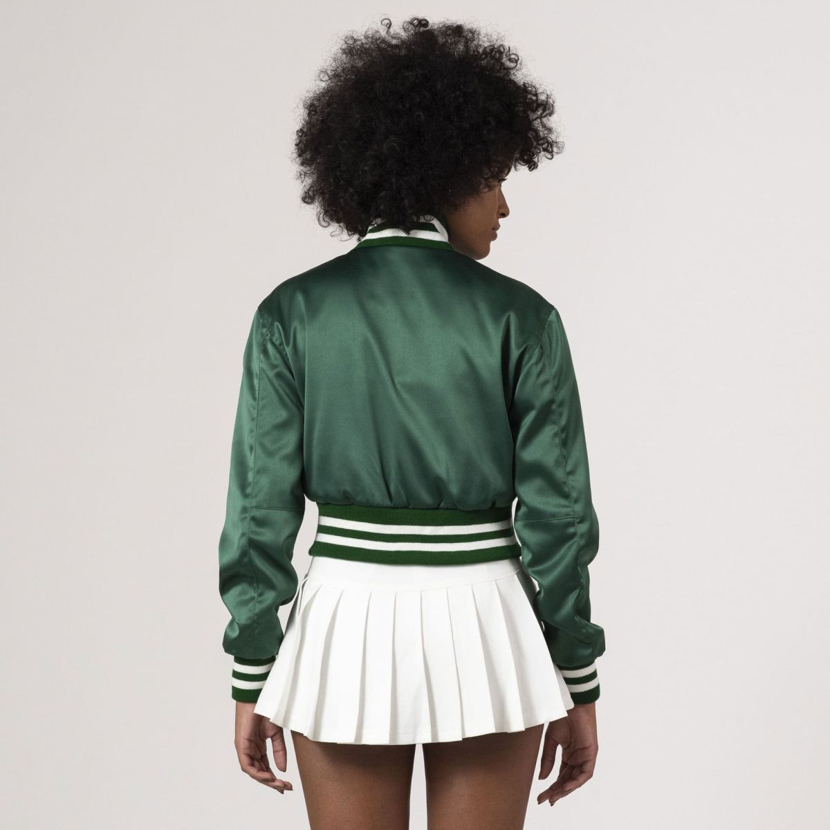 Fashion-forward Kelly green satin varsity crop jacket with cropped length and sporty charm