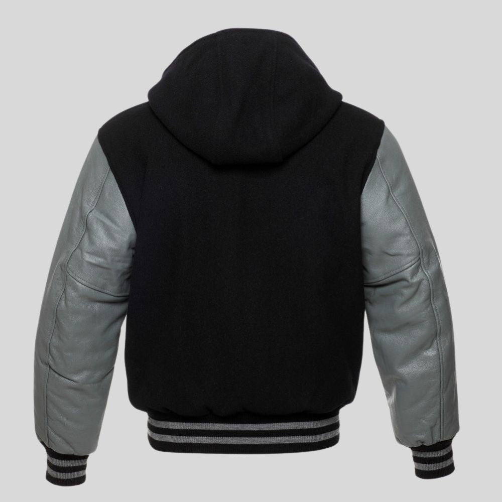 Black and gray varsity jacket with a hood on a light gray background