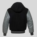 Black and gray jacket with hood on a light gray background