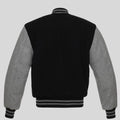 Black and gray varsity jacket on a light gray background