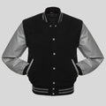 Black and gray varsity jacket on a light gray background
