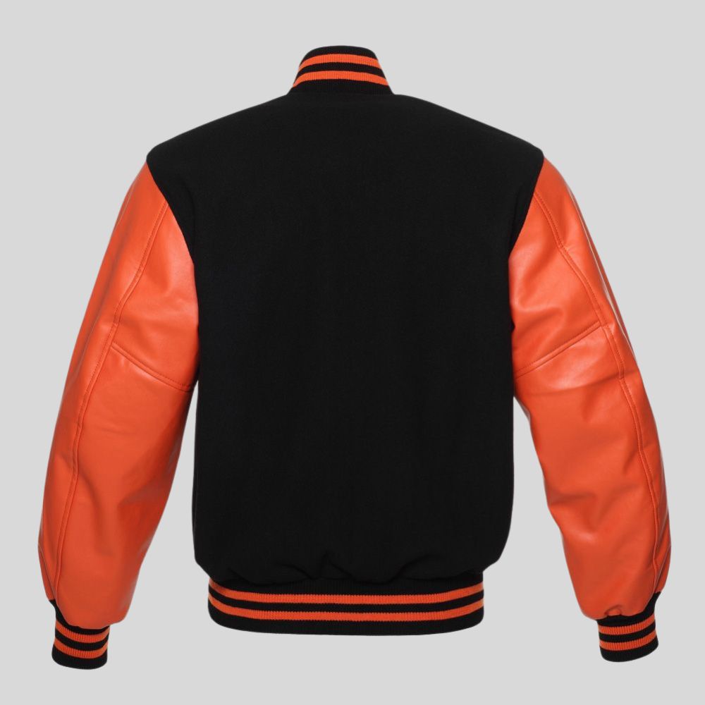 Black letterman jacket with orange sleeves on a gray background