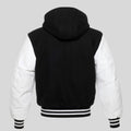 Black and white varsity jacket with a hood on a gray background